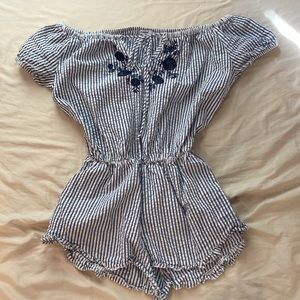 Subdued off the shoulder striped romper